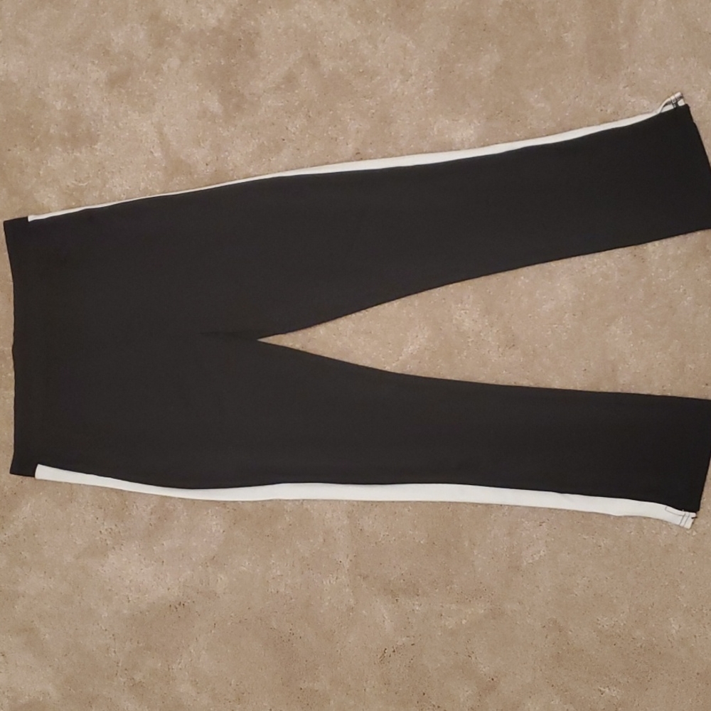 Black sweatpants with white straps